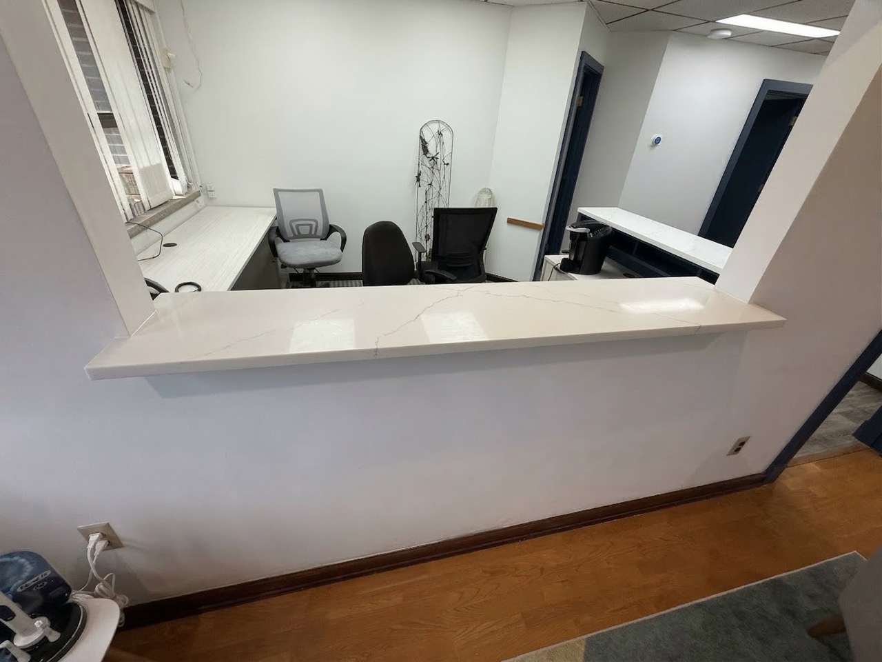 Renovated office workspace with open layout and improved lighting