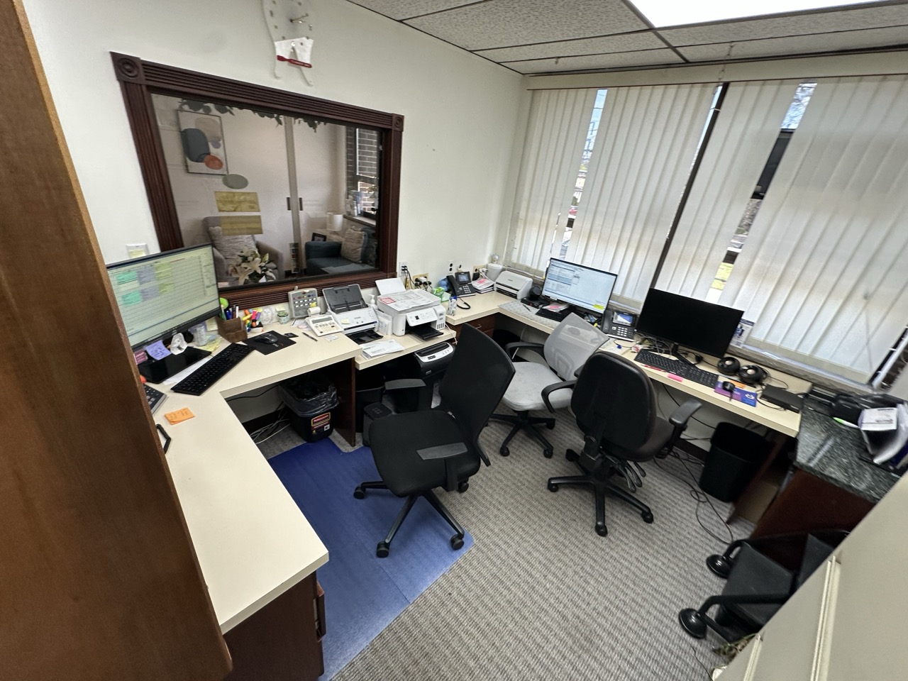 Cramped office workspace with old furniture
