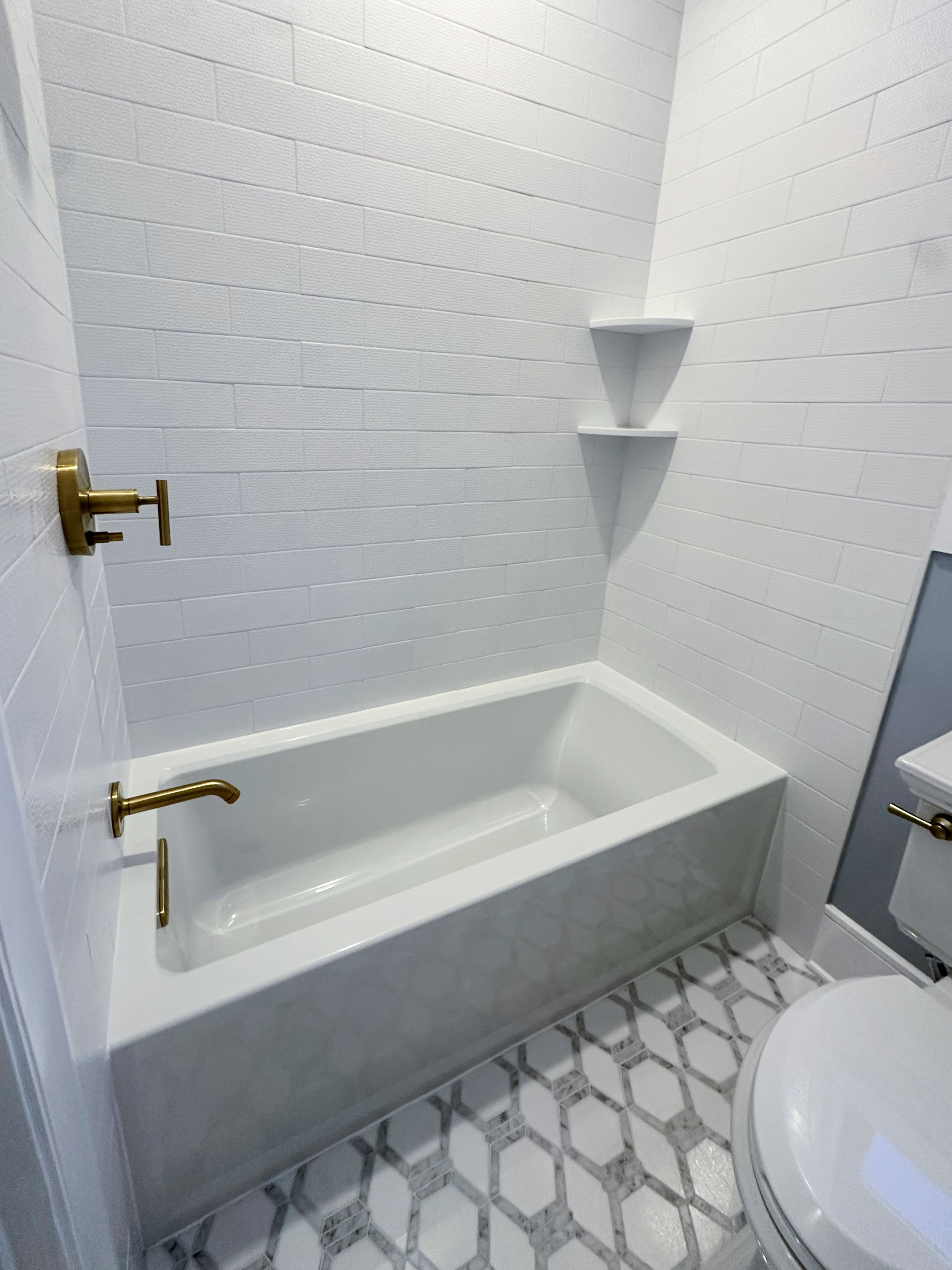 After: Short Hills bathroom with frameless glass shower, freestanding tub, and dual vanity.