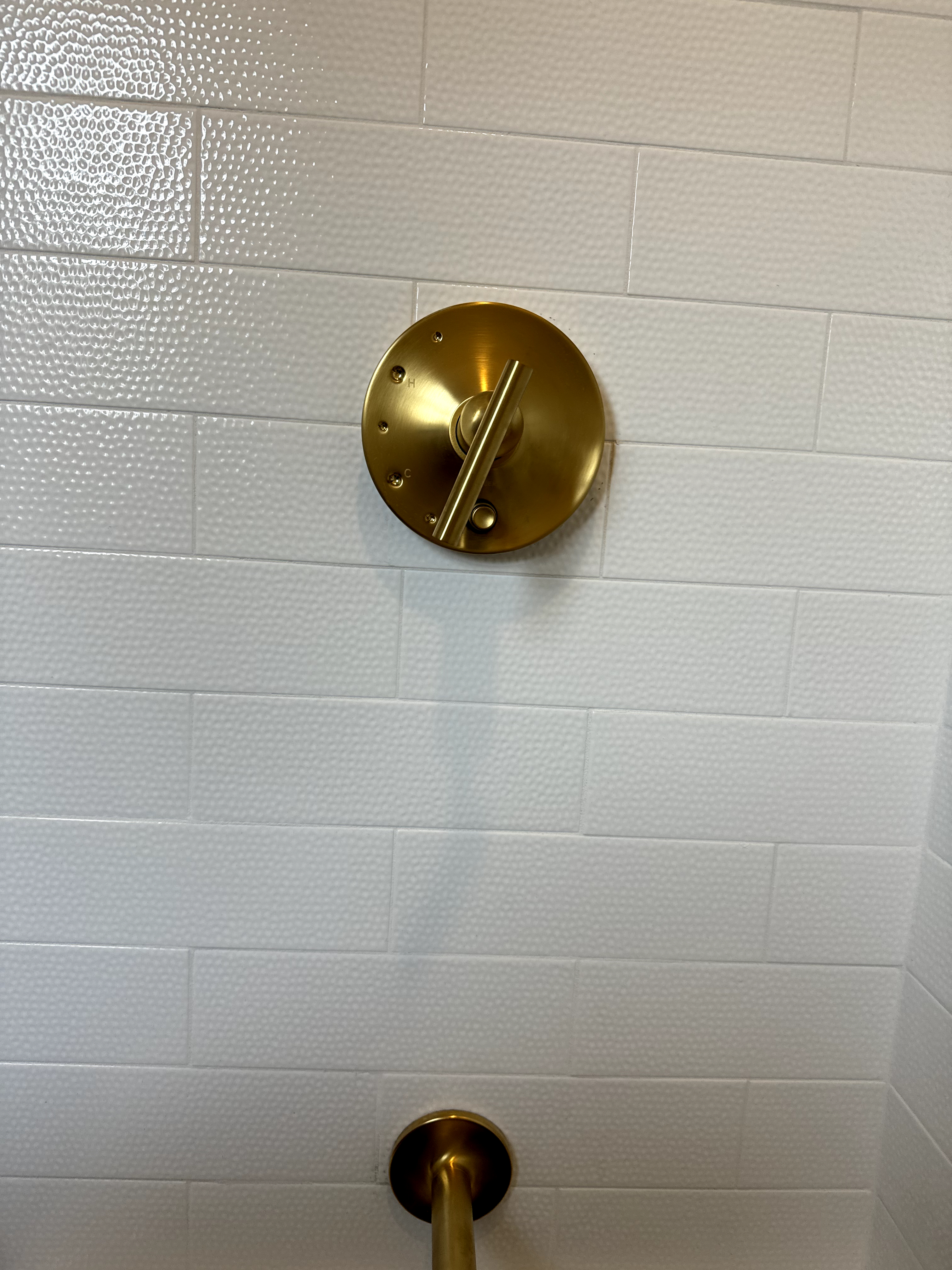 After: Short Hills bathroom with frameless glass shower, modern vanity, and hexagonal floor tile.