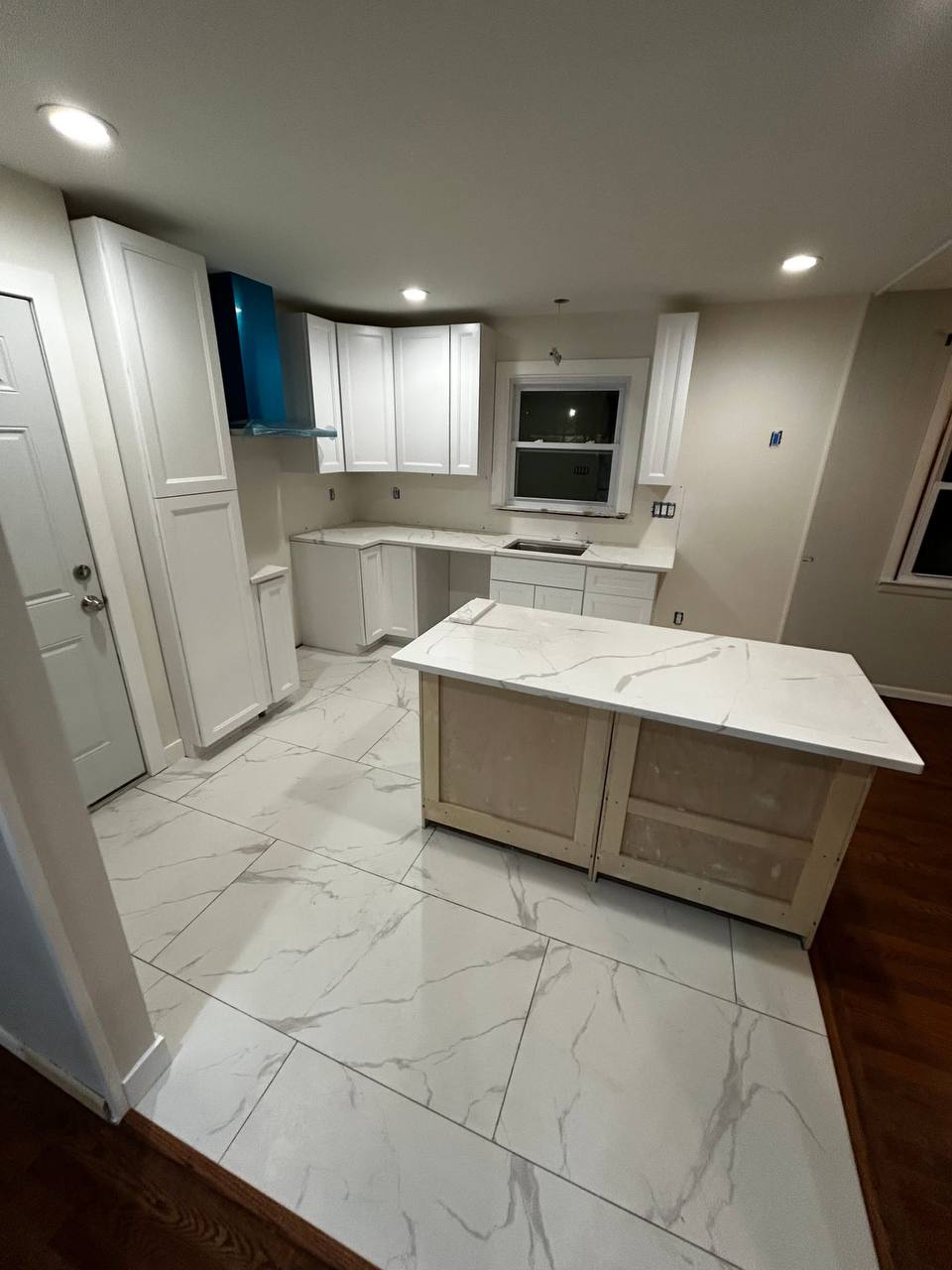 Renovated kitchen with new appliances and quartz countertops